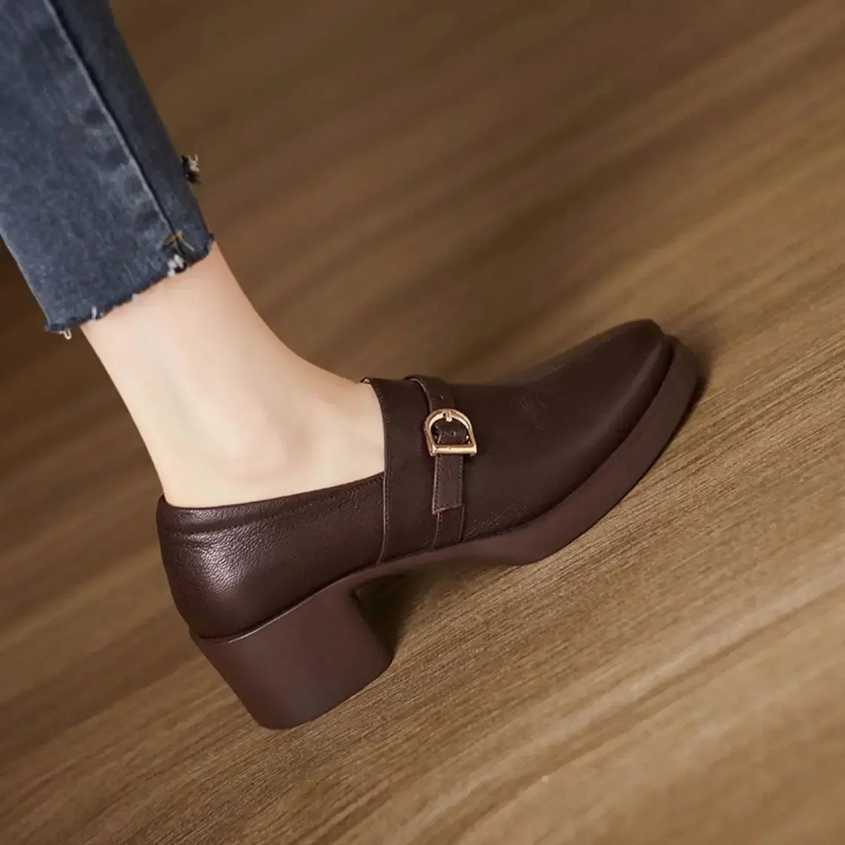 Celine block heels in brown, side view showing buckle strap