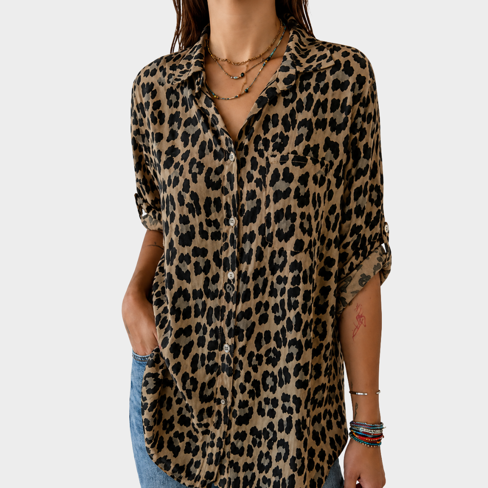 Elegant safari blouse in leopard print, front view worn with jeans