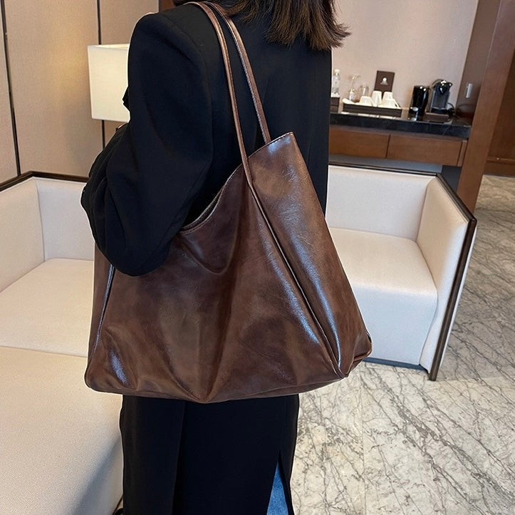 Odessa retro shoulder bag in brown, worn full-length view