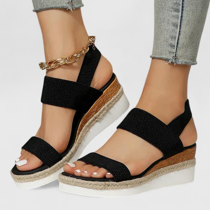 Merill orthopedic wedge sandals in black, worn with jeans