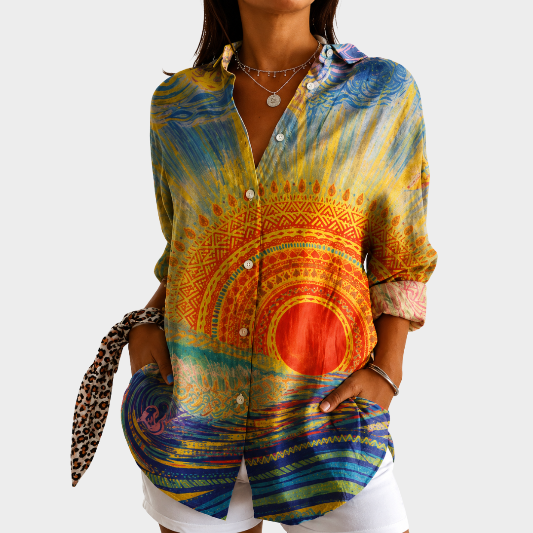 Warm Sunset blouse with painted sun print in orange and blue, front view