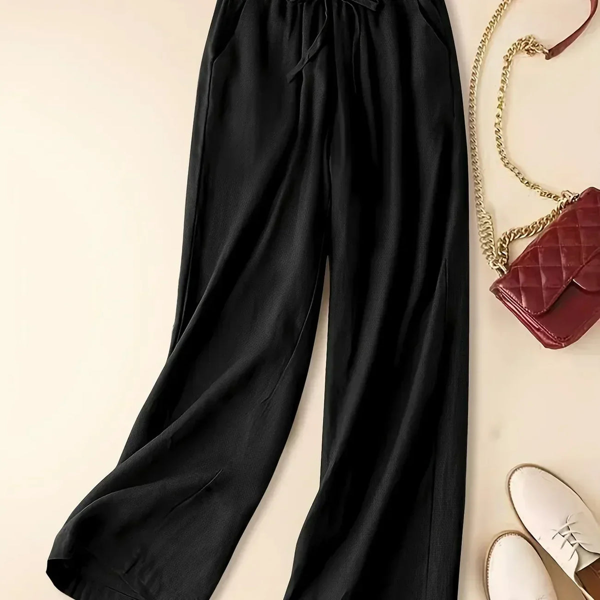 Imara wide-leg drawstring trousers in black, flat front view