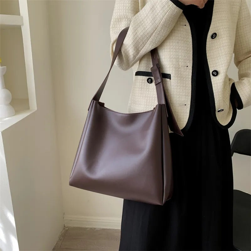 Delphine grand tote in coffee styled with cream jacket