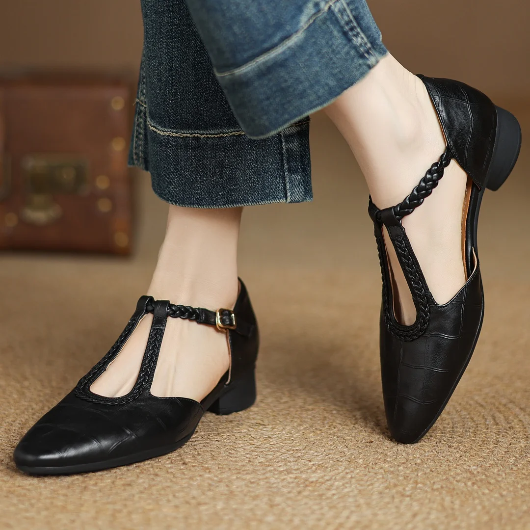 Evelyn Mary Janes in black, worn with cropped jeans, front view