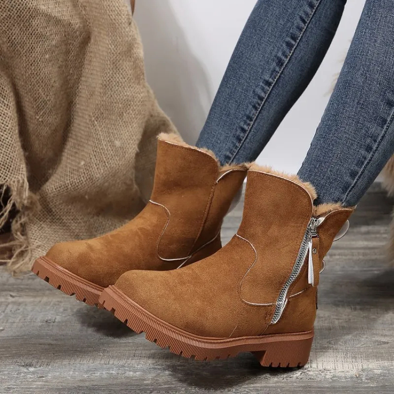 Noria warm winter boots in brown styled with jeans, side view
