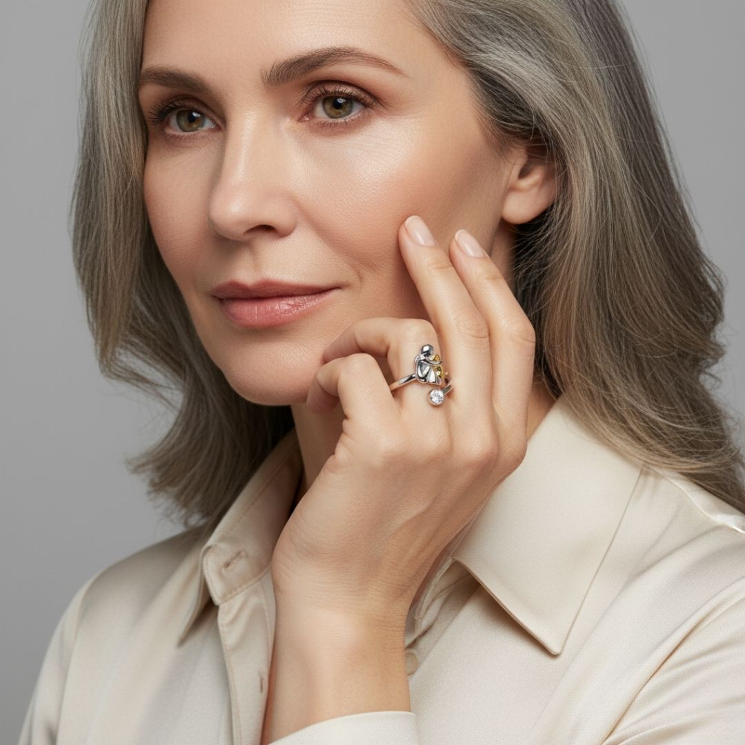 Vesporra dog icon ring worn on a model's hand, close-up view