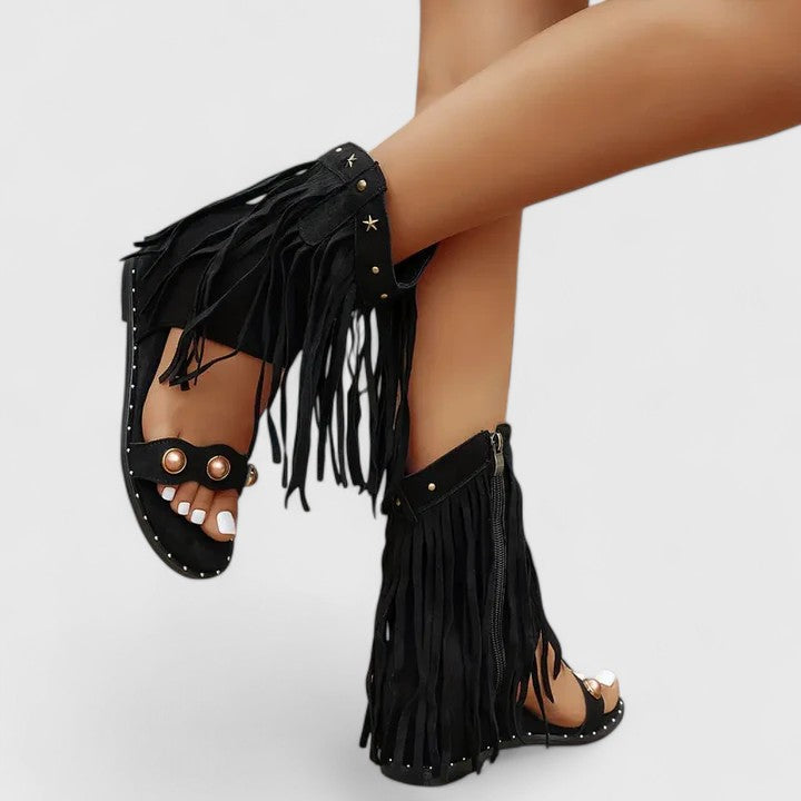 Giselina fringed sandals in black, worn full view