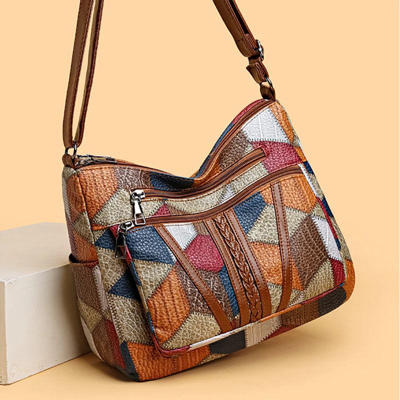 Nella patchwork bag in multicolour, angled front view showing zips