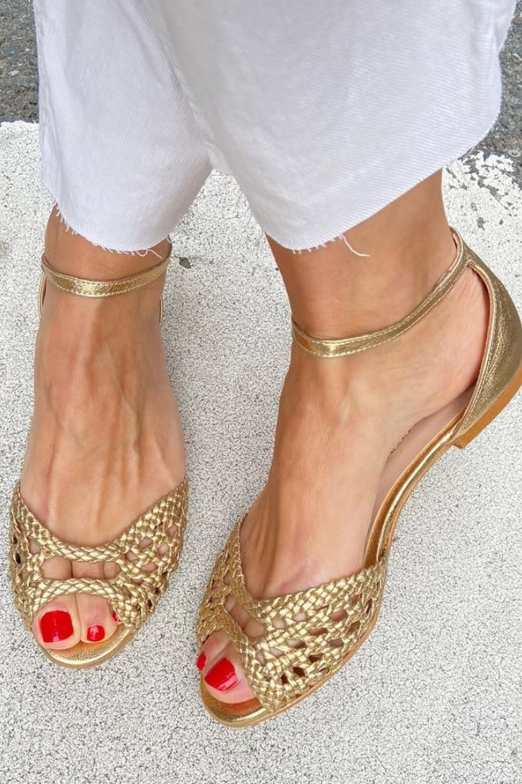 Isadora woven sandals in gold, close-up of ankle strap and flat sole