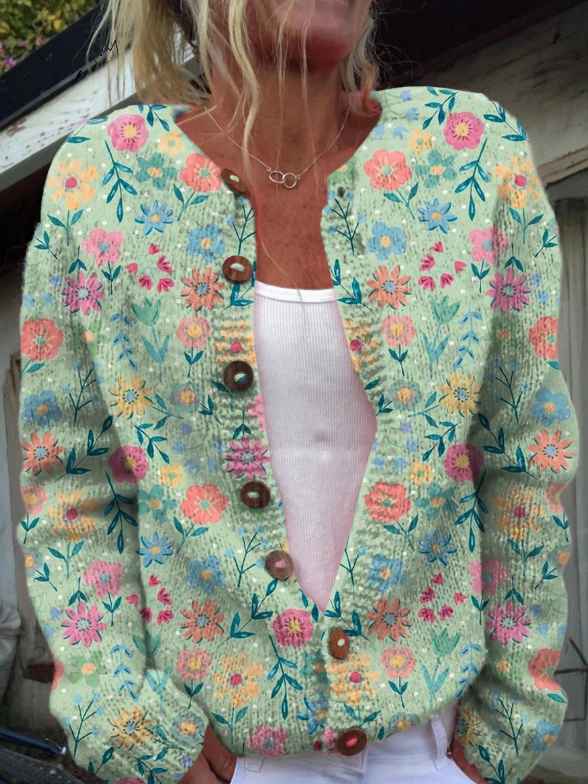 Foxfield vintage floral cardigan in mint green, worn open over a white top