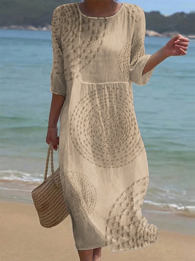 Embroidered casual midi dress in beige, full-length front view on the beach