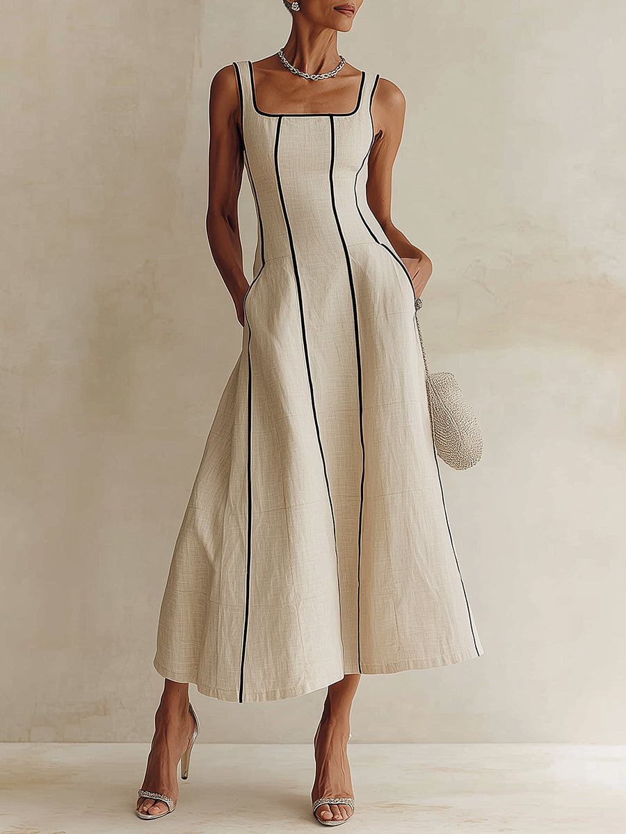 Camille A-line maxi dress in off white, front view with black seam trim