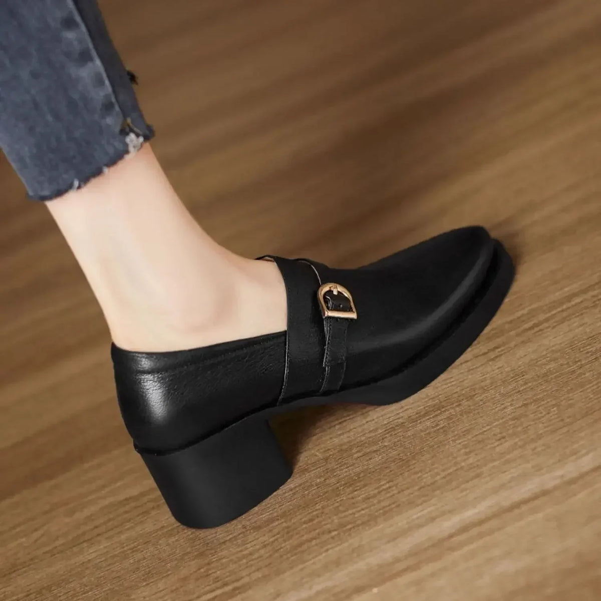 Celine block heels in black, side view with gold buckle