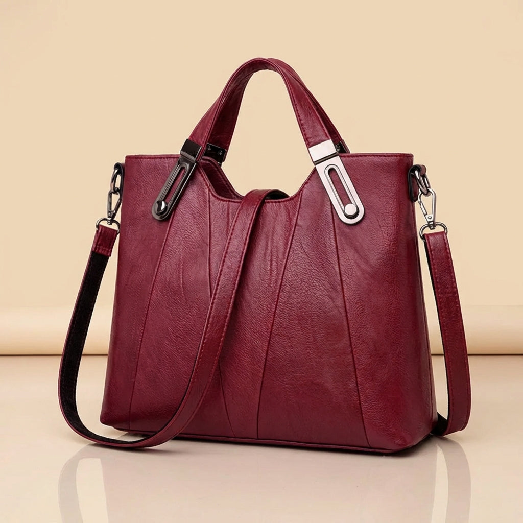 Sienna handbag in burgundy, three-quarter side view