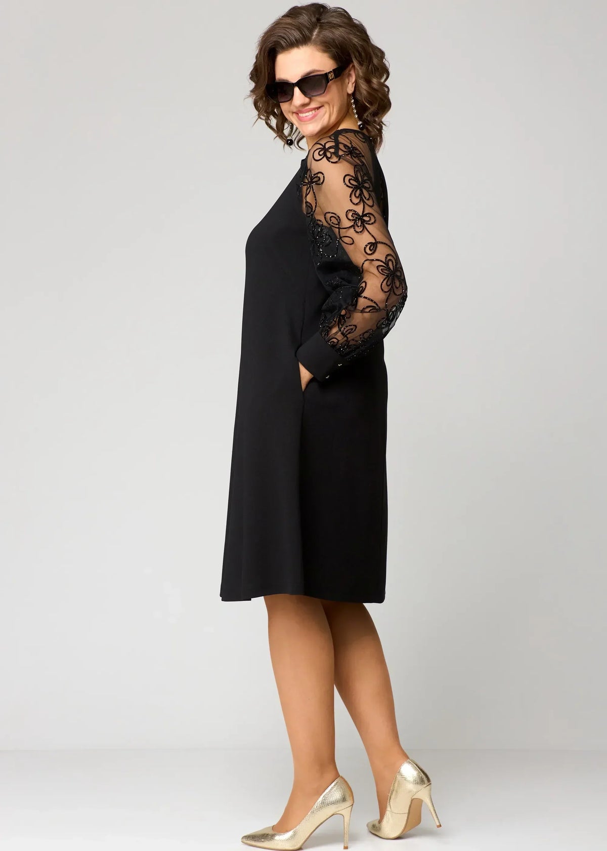 Edris lace dress in black, side view showing A-line shape