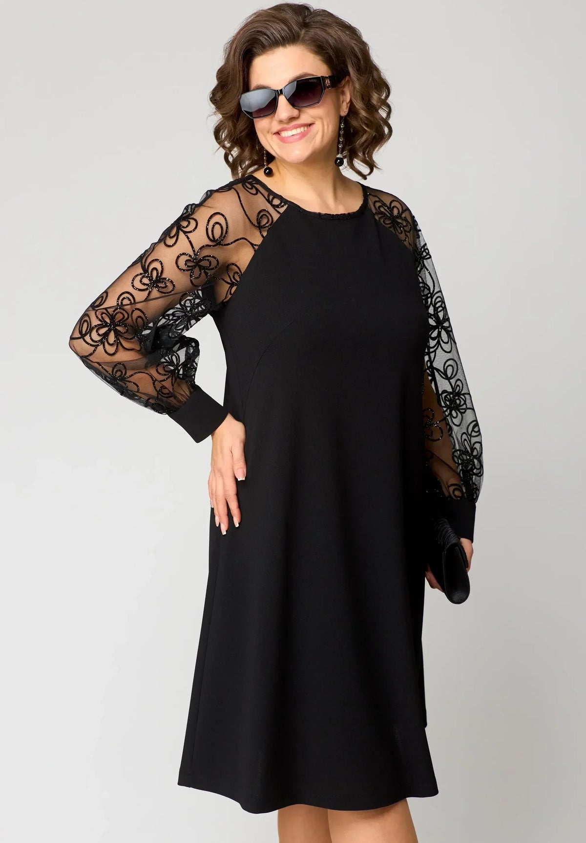 Edris lace dress in black, front view of relaxed A-line silhouette