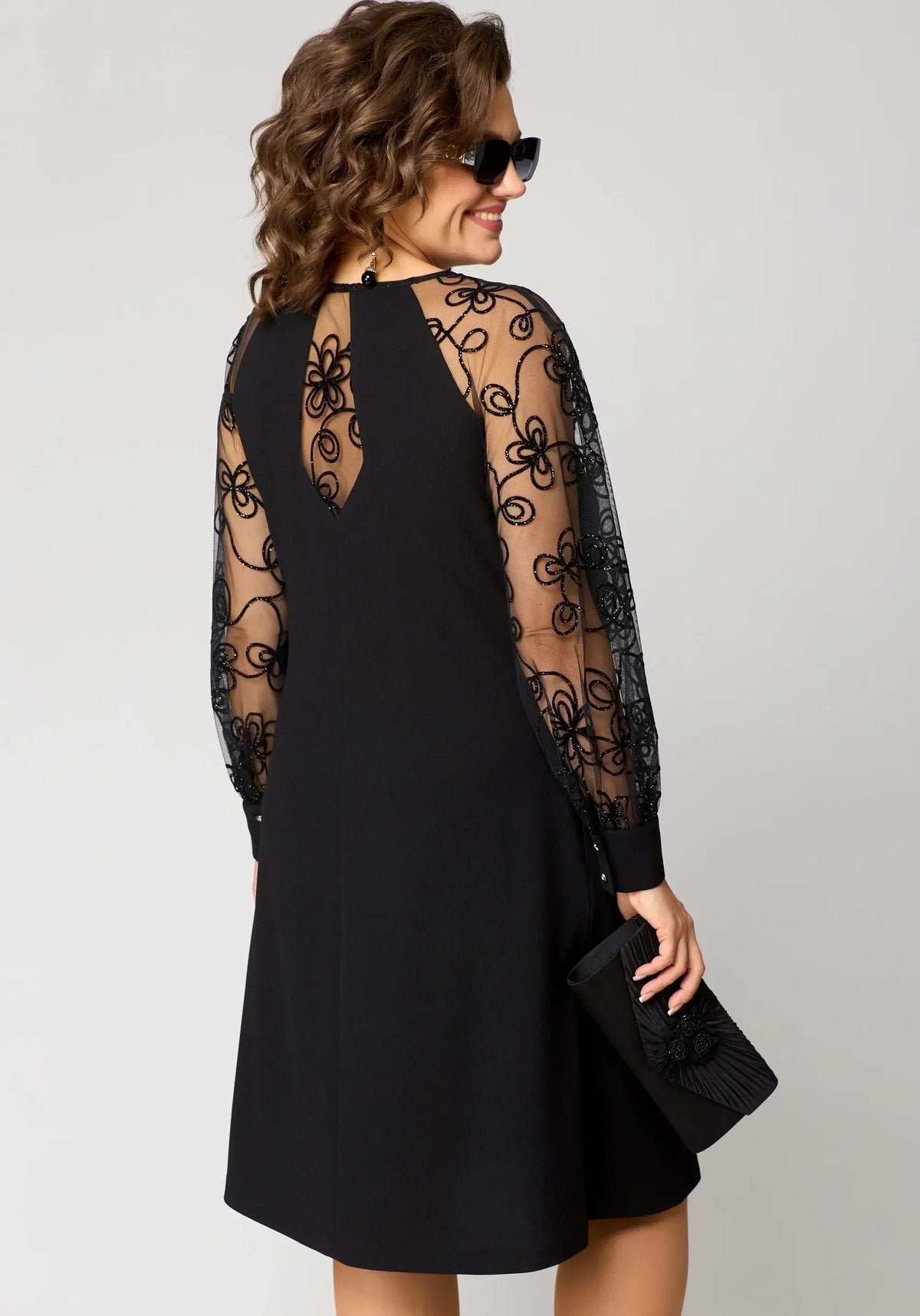 Edris lace dress in black, back view with sheer embroidered panel