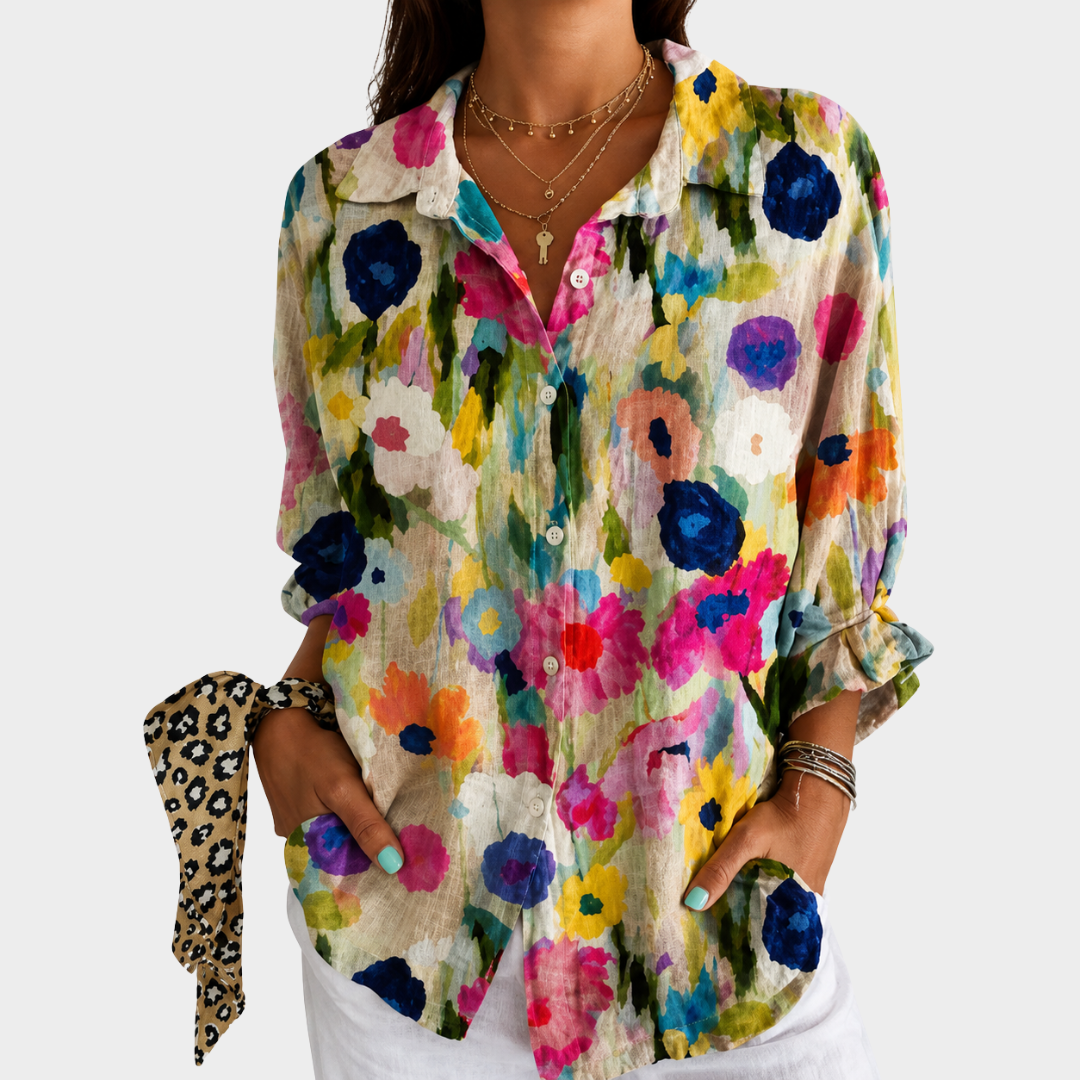 Watercolour floral blouse in multicoloured print, front view worn with white trousers