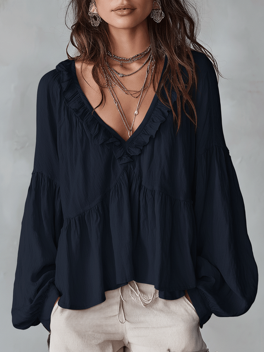 Vintage-inspired bohemian blouse in black, front view on model