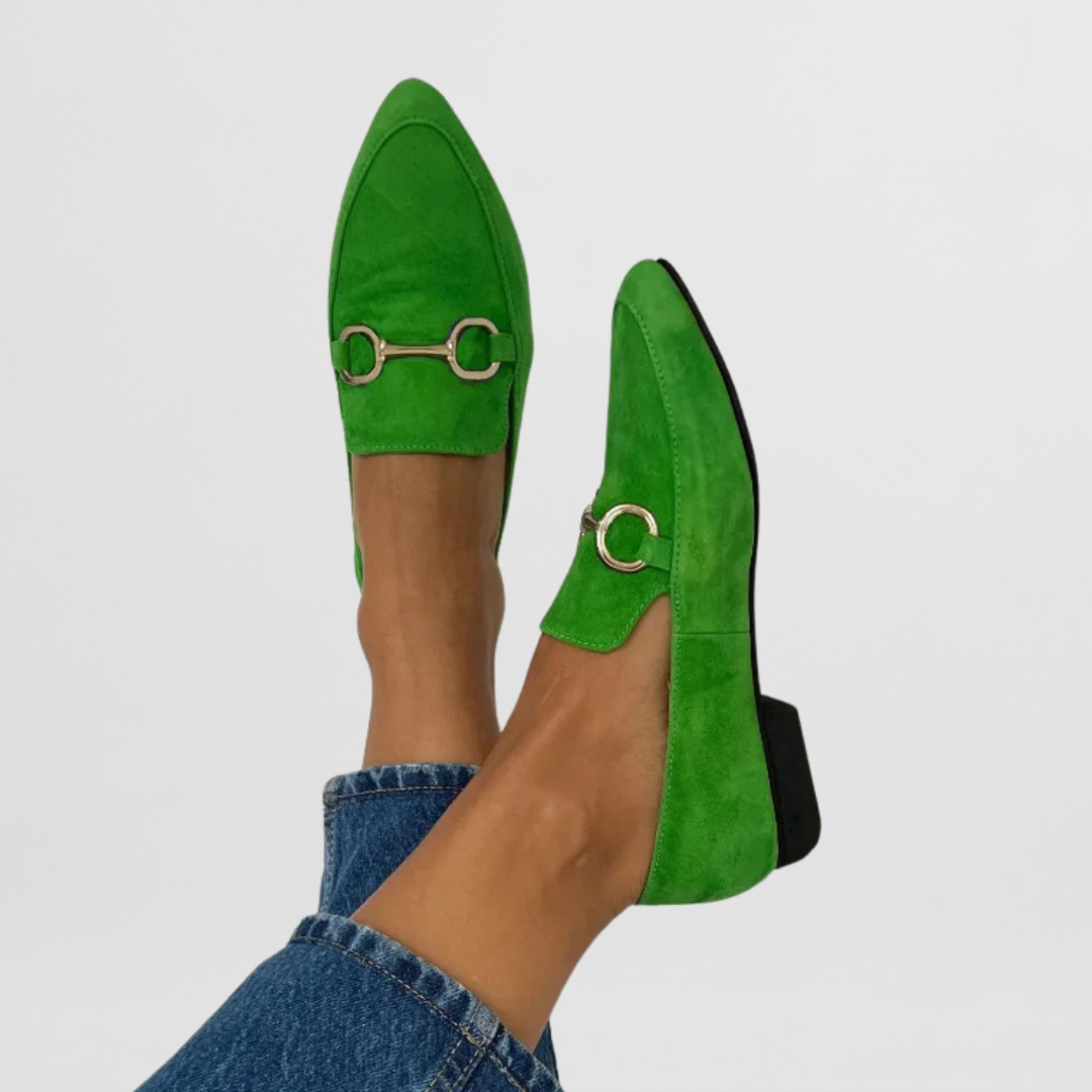 Florence pointed loafers in green with silver buckle, worn close-up view