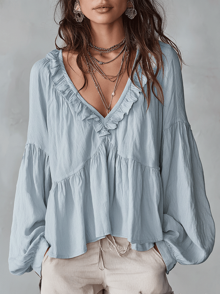 Vintage-inspired bohemian blouse in light blue, front view on model