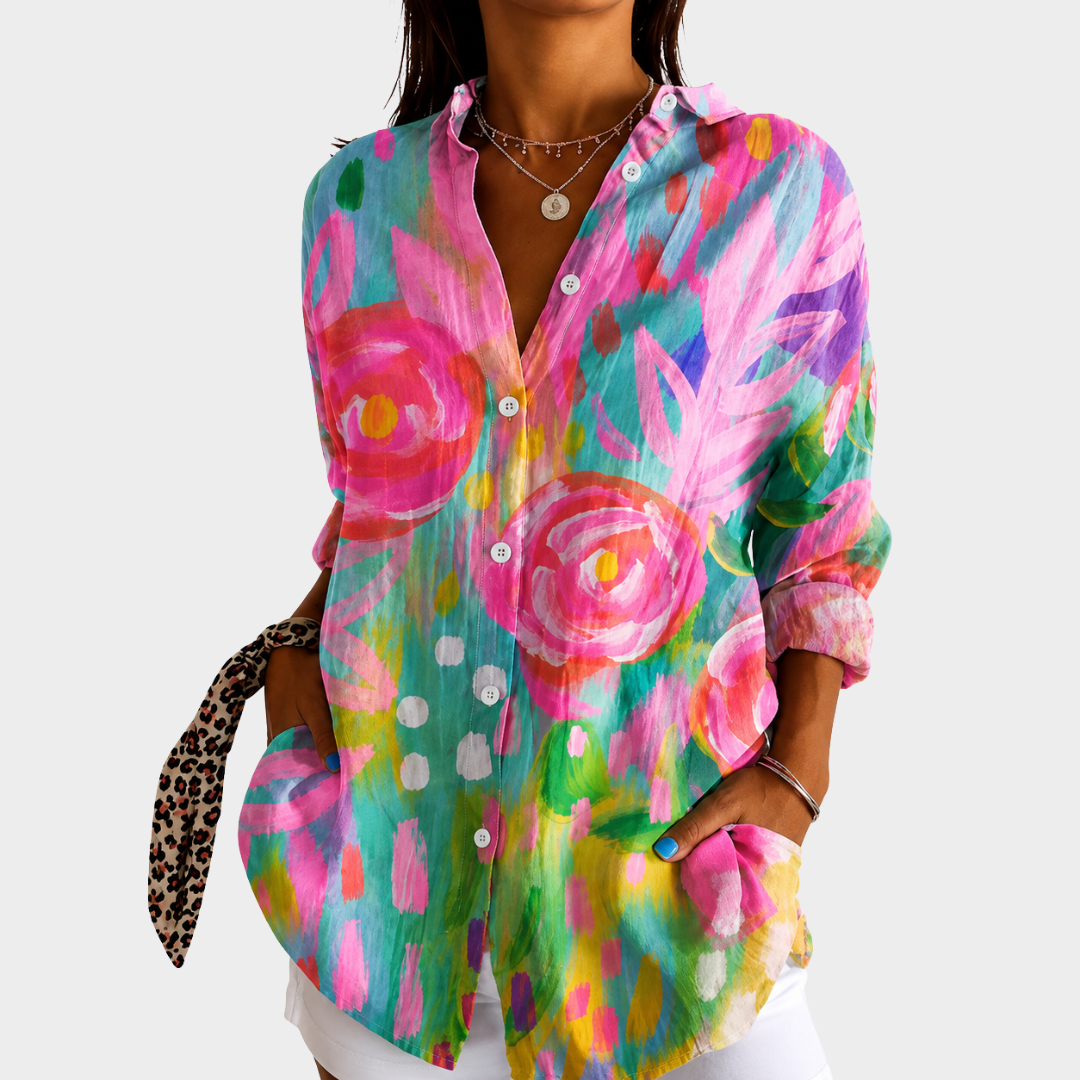 Hand-painted garden blouse in multicoloured floral print, front view worn with white trousers