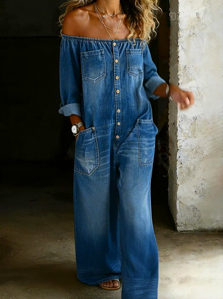 Elena off-shoulder denim jumpsuit in blue, walking front view