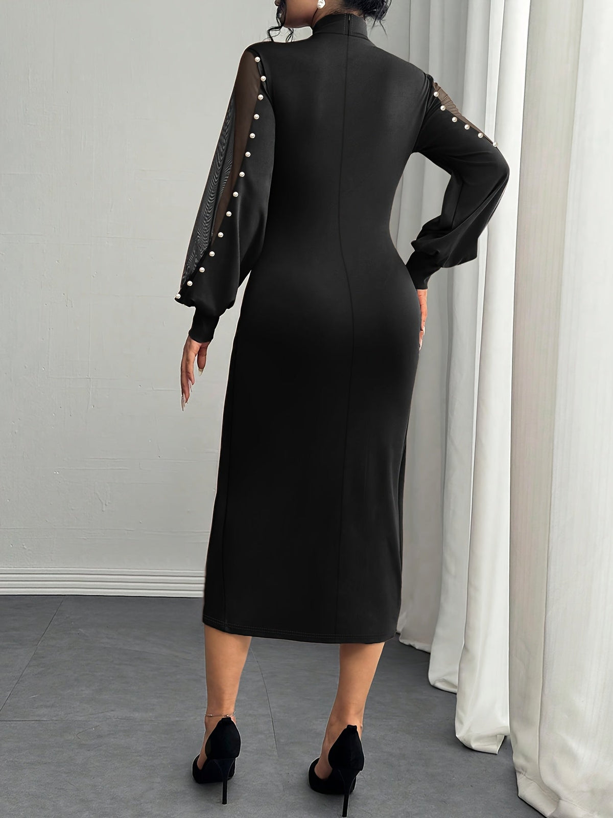 Latilda formal dress in black, back view