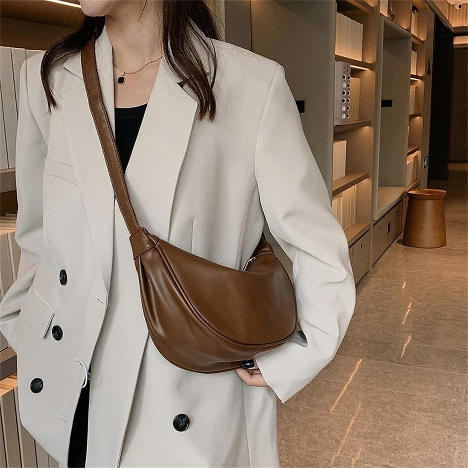 Maribel petite crescent bag in coffee brown worn crossbody, three-quarter view