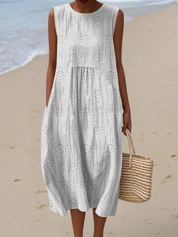 Rose embroidered midi dress in white, front view on the beach