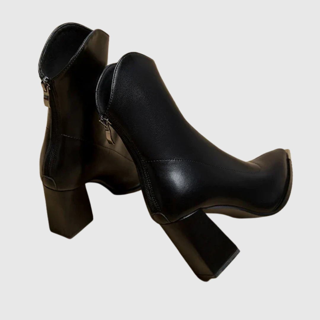 Black block heel ankle boots showing back zip closure