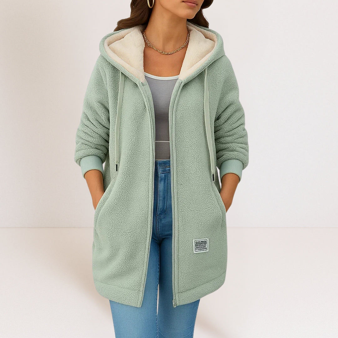 Thea longline hooded jacket in green, front view with cream-toned hood