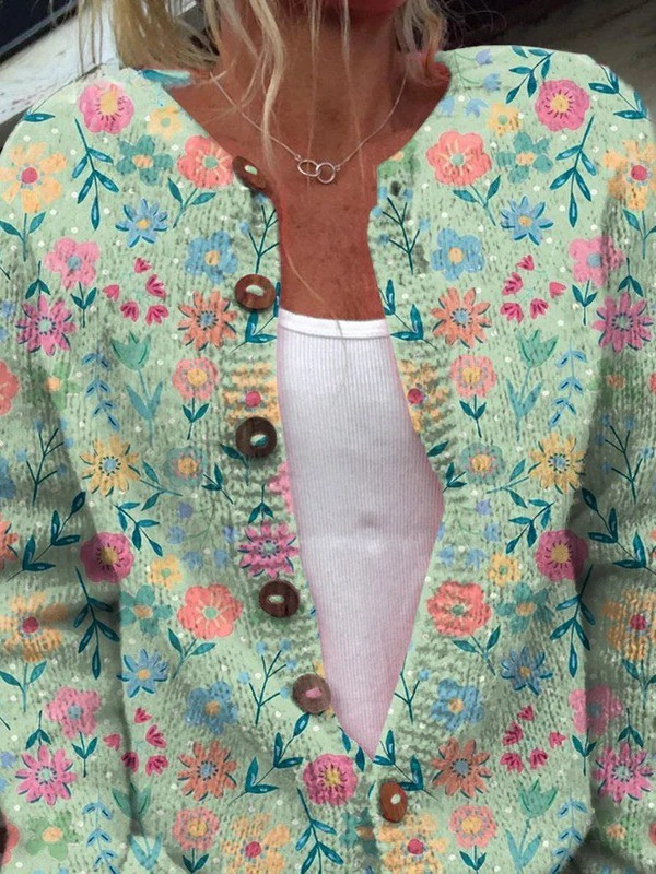 Foxfield cardigan close-up showing wooden toggle buttons and pastel floral knit
