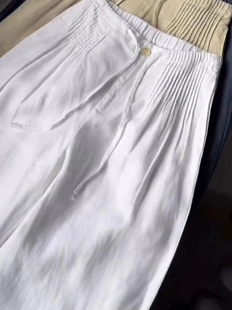 Zerena wide leg trousers in white, close-up of waist and side gathers