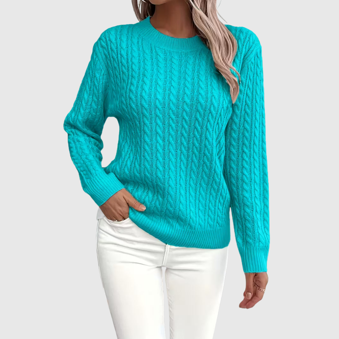 Isla cable-knit sweater in blue, front view on model