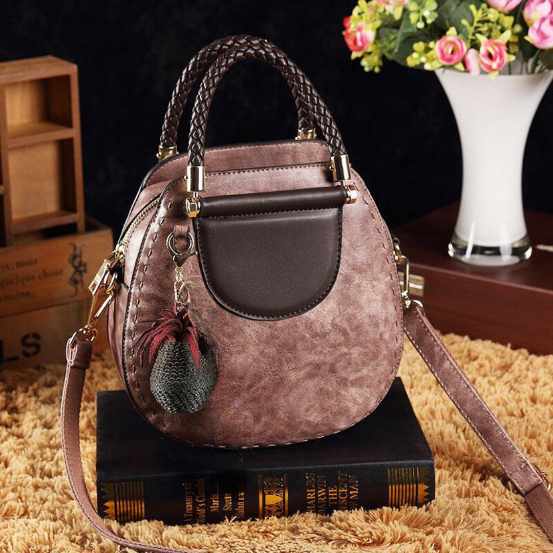Naelle crossbody bag in pink, front view with shoulder strap