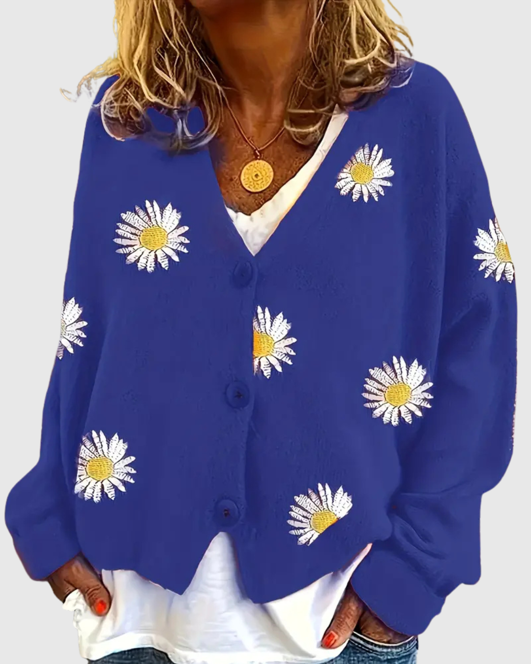 Irene knit button cardigan in blue with daisy motifs, front view