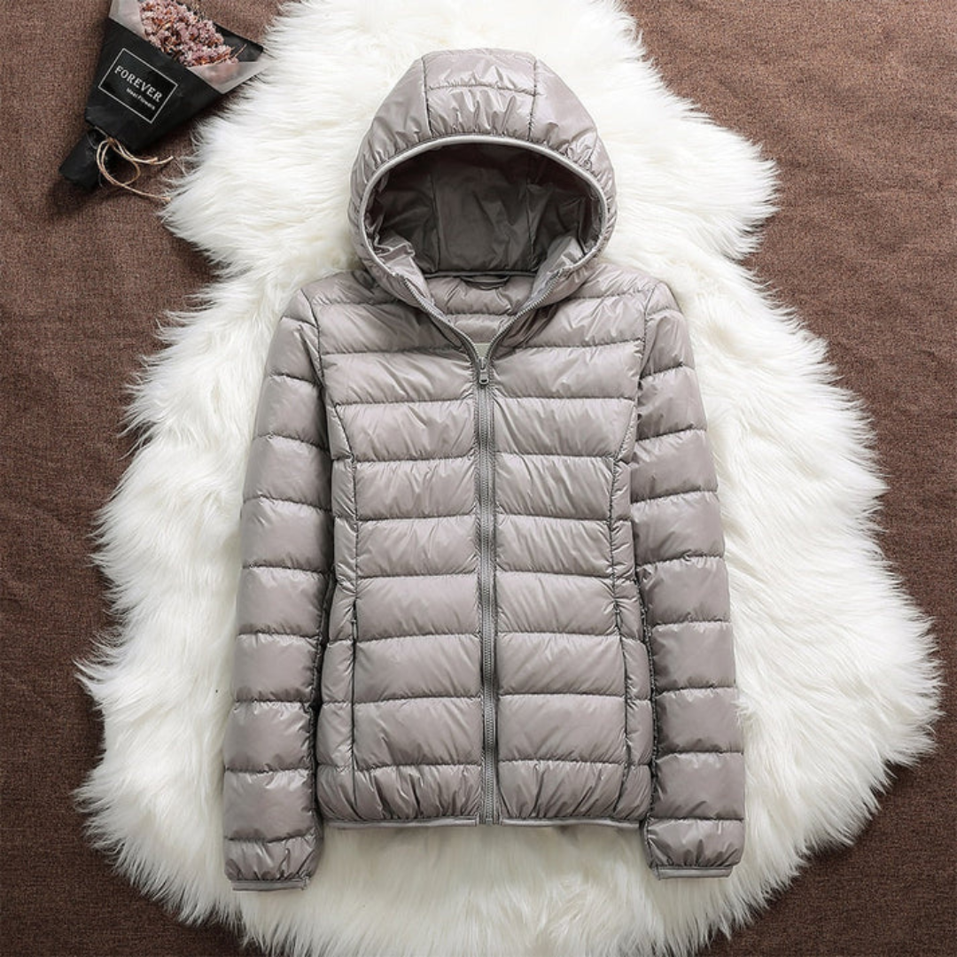 Metta padded jacket in grey laid flat, zip and hood detail
