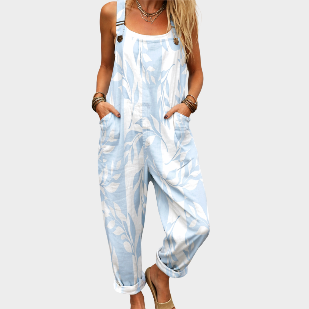 Printed wide-leg dungarees in blue and white leaf print, full-length front view
