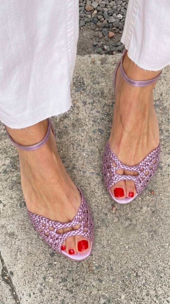 Isadora woven sandals in lavender, front view worn with white trousers
