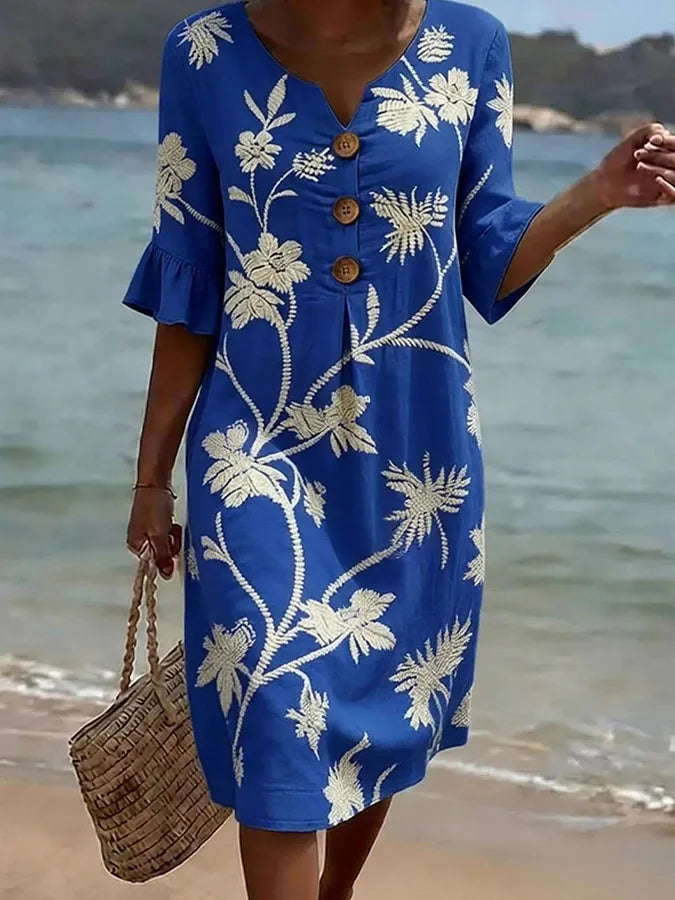 Blue floral print casual dress with ivory blooms and wooden buttons, full-length front view