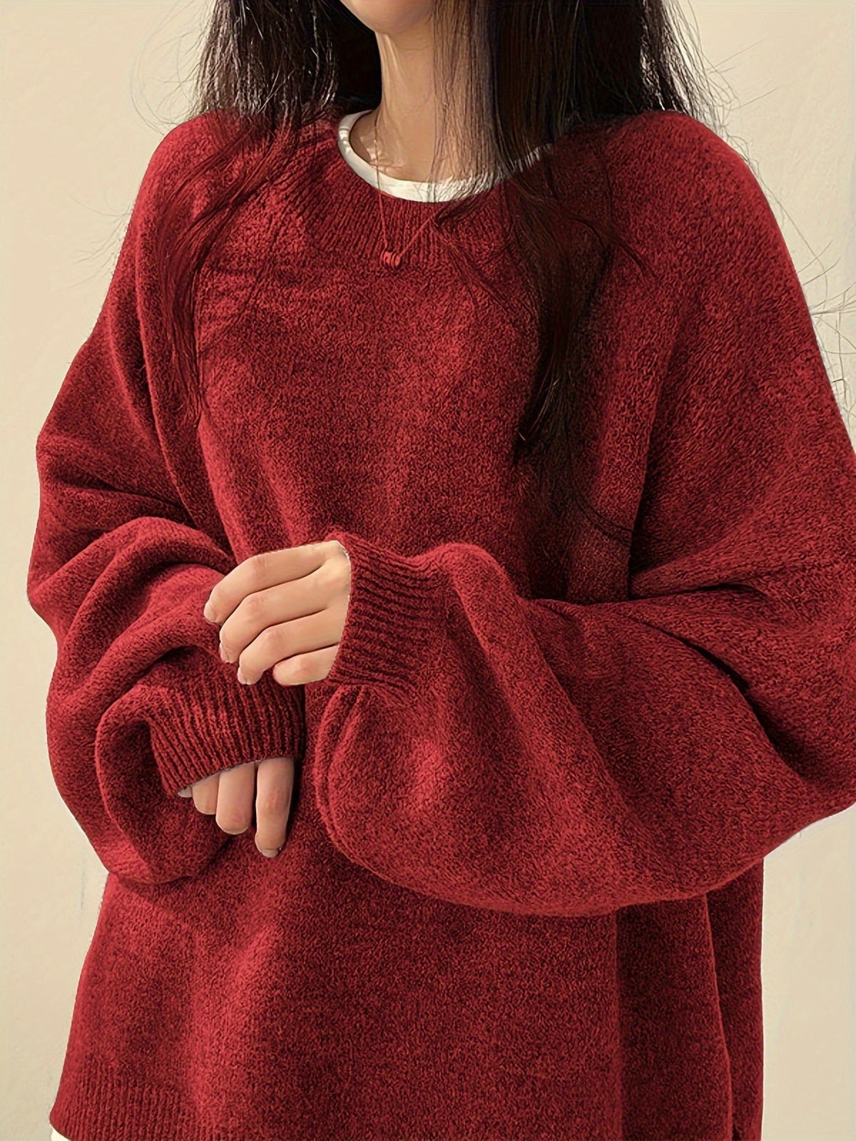Everlight oversized sweater in crimson, close view of ribbed cuff