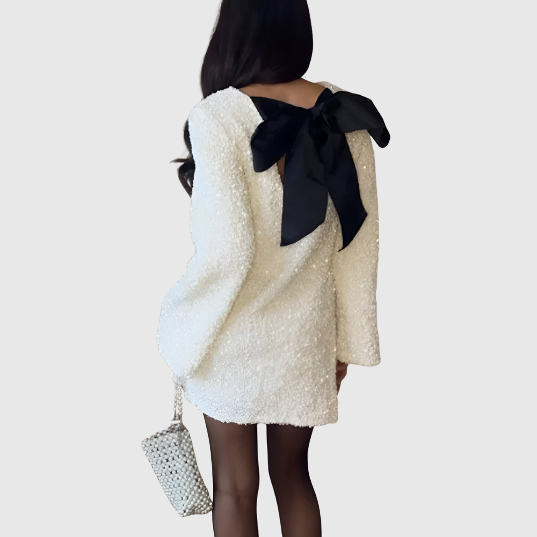 Maribelle bow-tie dress in white, back view showing black bow detail