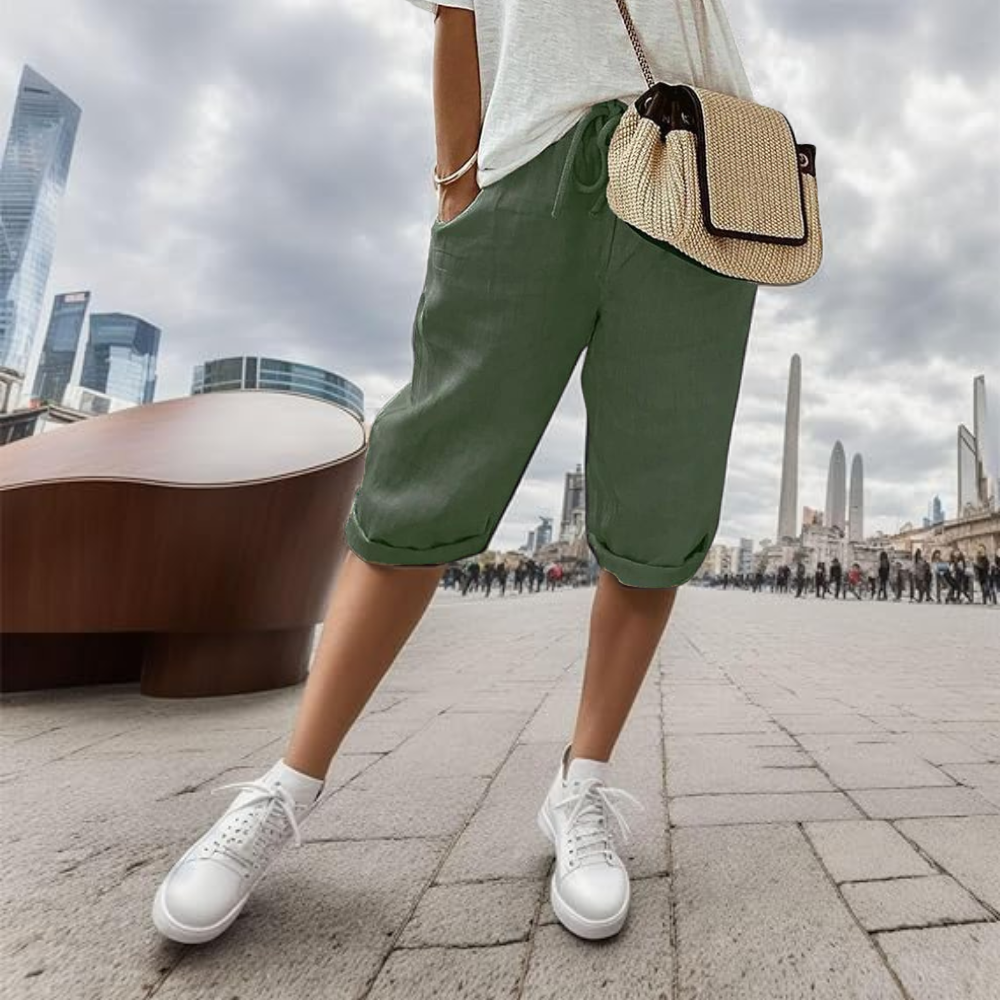 Noa cotton linen shorts in green, front view on model