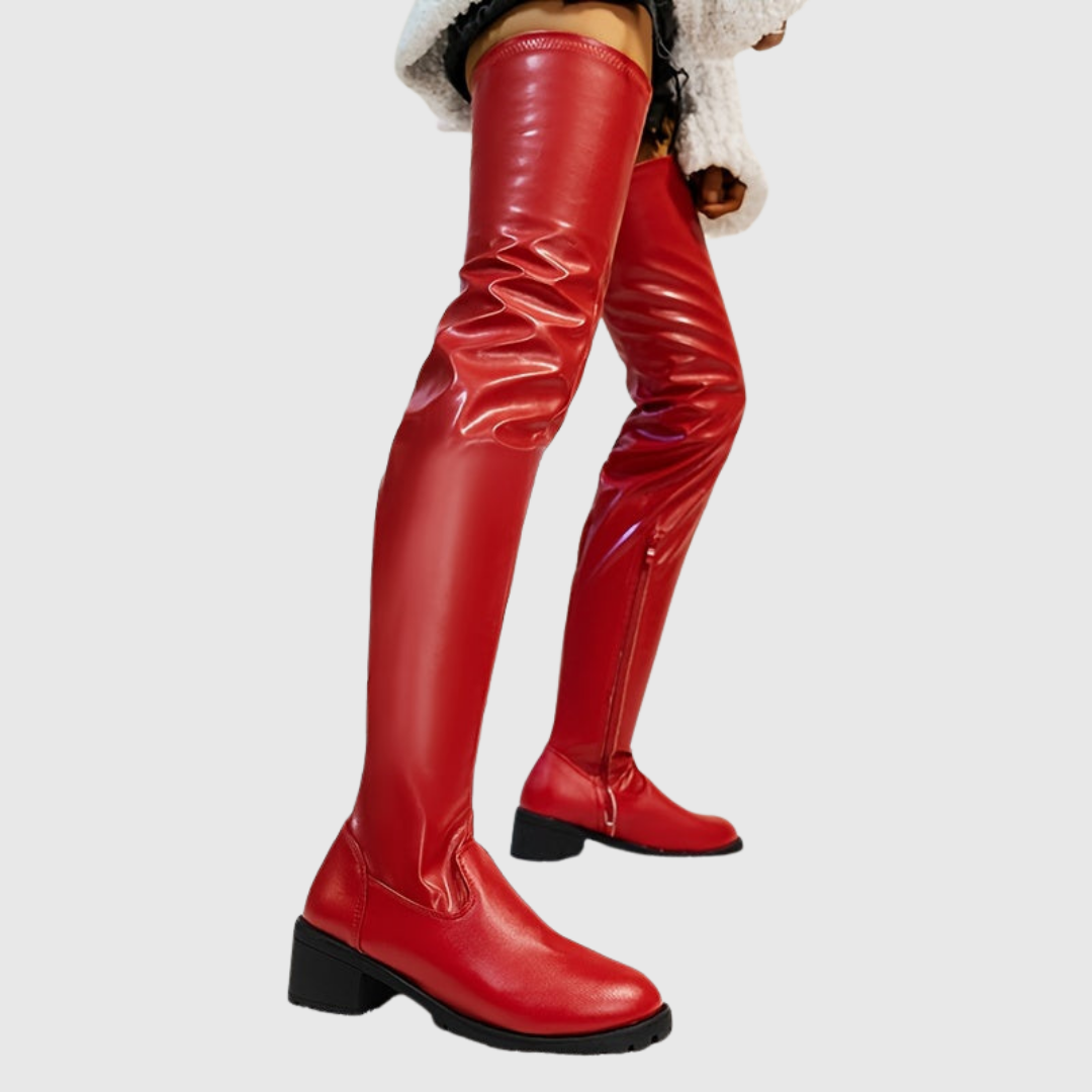 Fenisse thigh-high boots in red, three-quarter view on model