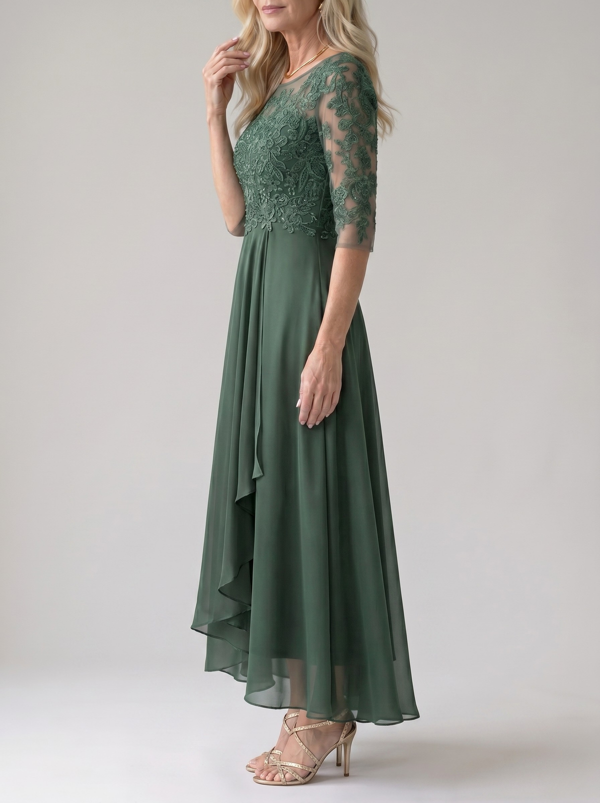 Rhonda lace dress in green, side view of flowing skirt