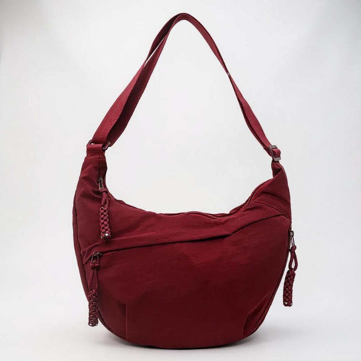 Rosalie crescent shoulder bag in burgundy, front view with braided zip pulls