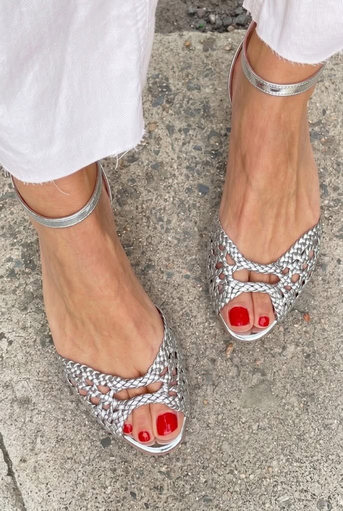 Isadora woven sandals in silver, front view on pavement