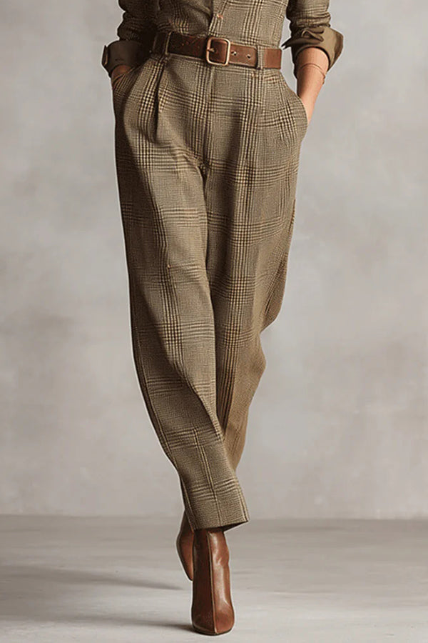Aubrette jumpsuit in brown, close-up of belted pleated waist and tapered legs