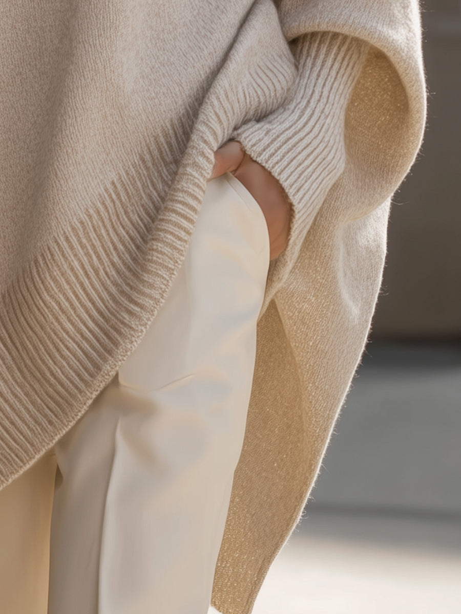 Wanwen oversized sweater in beige, close-up of ribbed cuff and draped side